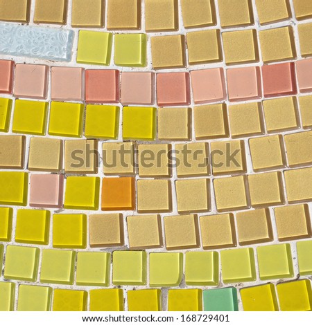 closeup of the texture decorated with colorful glass mosaic and tile