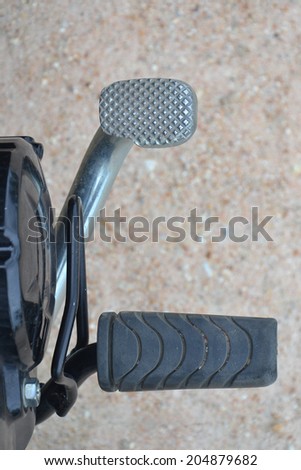 close up brake pedal of motorcycle