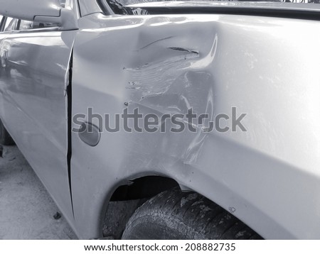image of side view of a crashed car