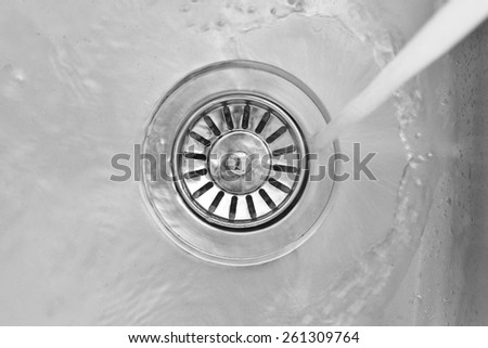 water flowing down the hole of kitchen sink