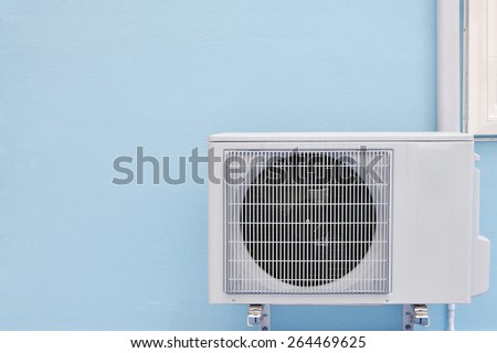air conditioning compressor on wall