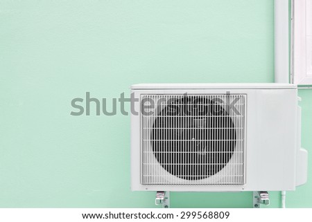 air conditioning compressor on wall