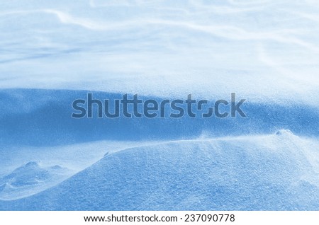 Winter background with snow drifting snow
