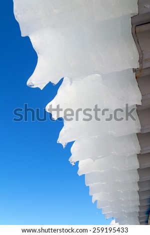 Ice hanging from the roof of the house