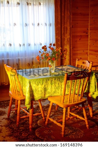 Interior cozy room with chairs and a table