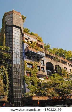 VIENNA - AUGUST 8: Facade of the Hundertwasser house with trees and bushes on the front in Vienna, Austria on August 8, 2011.