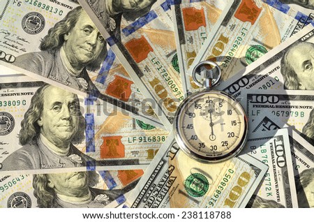 Stopwatch and dollars (time is money, capital, savings, profit - concept)