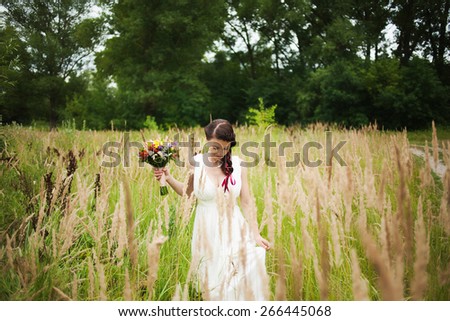 beautiful bride in summer field