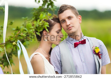 beautiful wedding couple in green nature landscape. happy bride and groom. wedding couple in love.