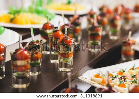 Catering for party. Close up of sandwiches, appetizers and fruit