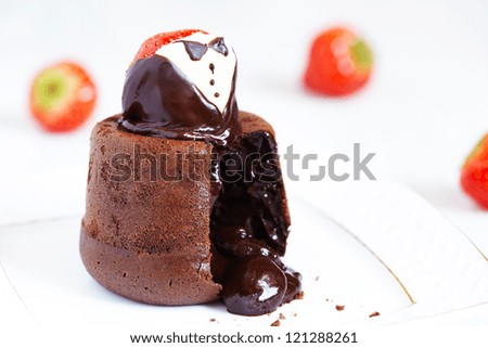 Molten lava cake with strawberry in tuxedo