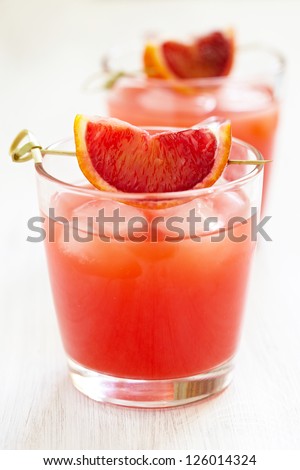 blood orange cocktail with slices of blood orange