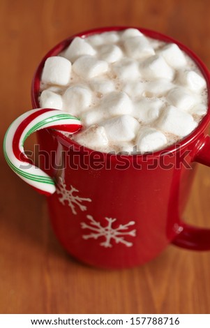 Red mugs with hot chocolate and marshmallows