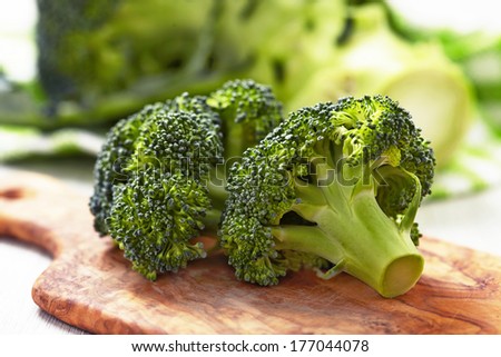 Fresh Raw Broccoli On Wooden Board