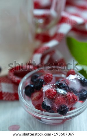 Ice cube with fresh berry star shape