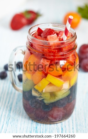 Fresh Summer Rainbow Sangria with Colorful Fruits And Berries
