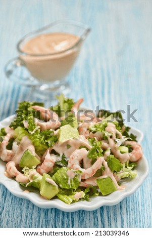 Fresh green salad with shrimp and avocado