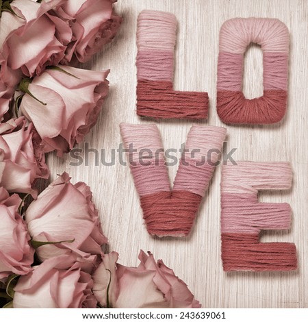 Valentine\'s day concept with letters love and flowers