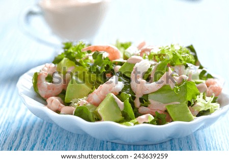 Fresh green salad with shrimp and avocado