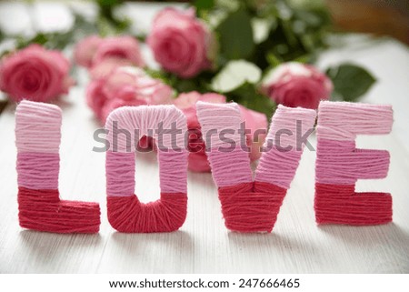 Valentine\'s day concept with letters love and flowers
