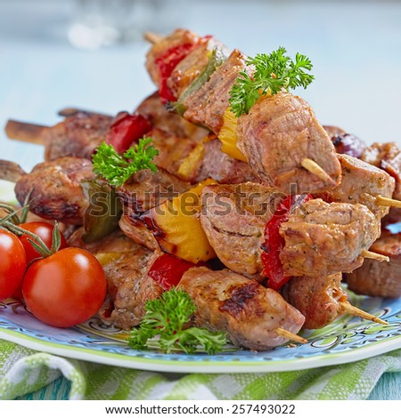 Delicious grilled pork meat and vegetable kebabs