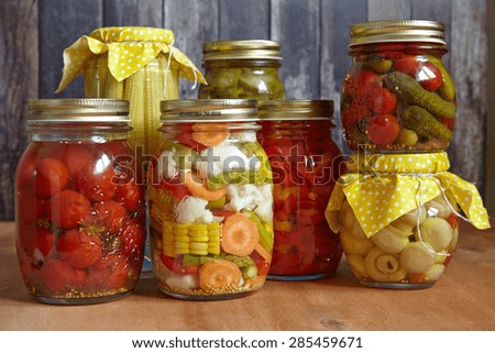 Assortment autumn preserves. Jars of pickled vegetables.