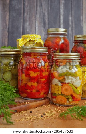 Assortment autumn preserves. Jars of pickled vegetables.