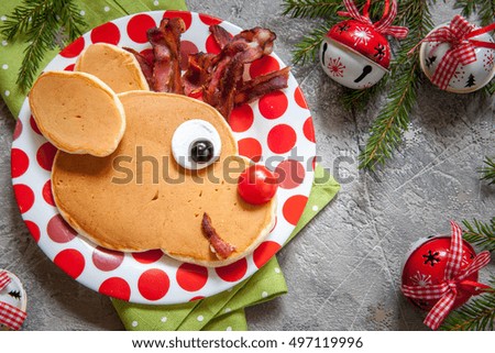 Christmas fun food for kids. Reindeer pancake for breakfast