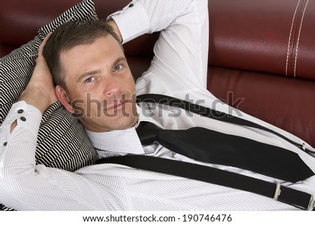 businessman laying on couch