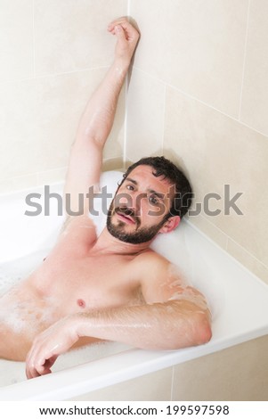 latin man relaxes in a bathtub