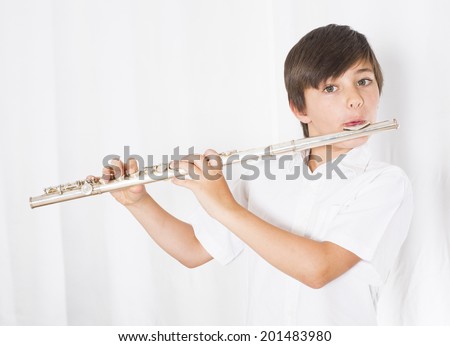portrait of a boy playing the flute