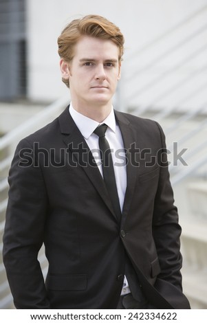 portrait of a handsome businessman in a black suit