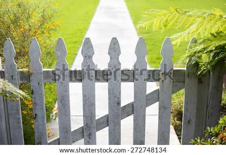white picket fence and a walkway