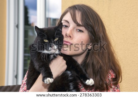 portrait of a young woman with her cat