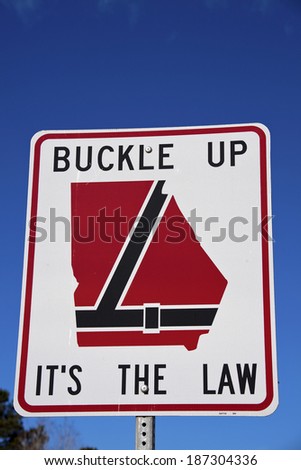 Buckle up Georgia - road sign seen on the highway
