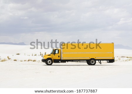 Yellow truck in White Sand Dunes NM - New Mexico.