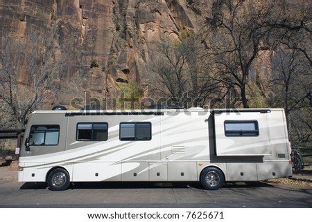 Luxury RV against the rocks of Zion National Park
