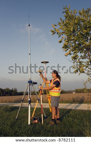 Land Surveyor with GPS unit.
