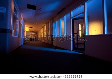 old abandoned hospital building internals light painted at night