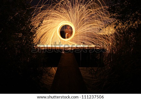 firework / wire wool on fire at night on a jetty