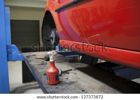 car in garage getting repaired / fixed