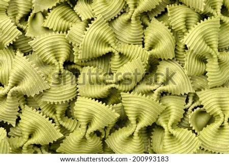Food: uncooked green spinach farfalle pasta background