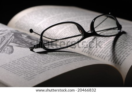 Reading glasses on a anatomy guide