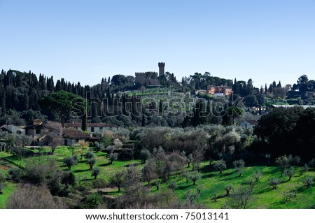 Tuscan landscape with typical house and olive trees