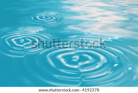 three water circles in clear blue water background