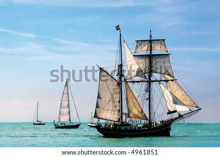 nostalgic pirate-ship sailing the caribbean on a sunny day