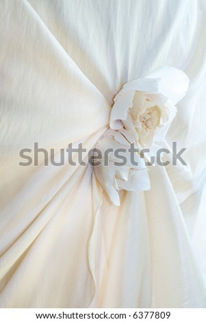 stock photo detail of a champagne colored wedding dress with silk roses 
