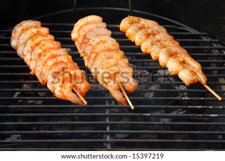Outdoor cooking in summertime with shrimps on bbq