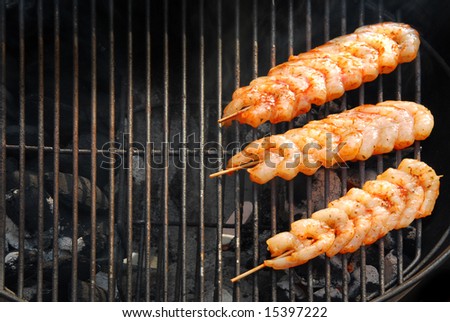 Outdoor cooking in summertime with shrimps on bbq