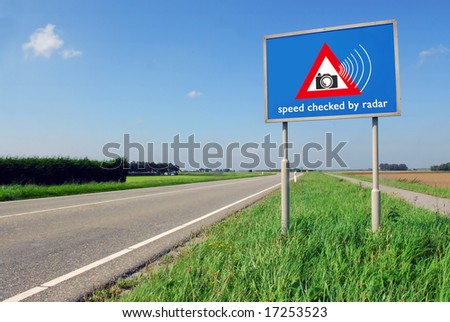 Speed checked by radar roadsign in rural landscape on empty road